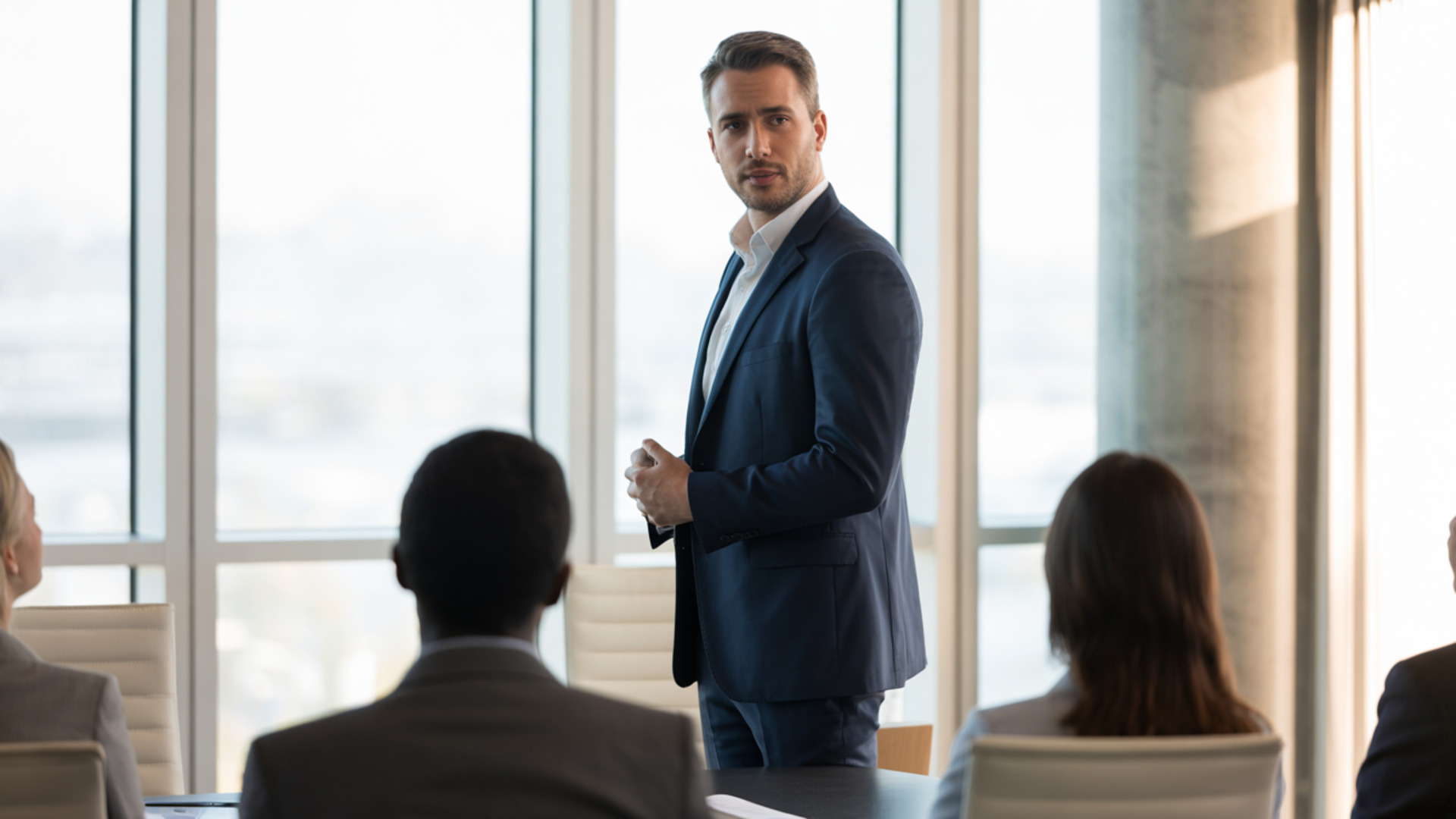 Leader confidently addressing a group of professionals